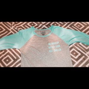 A mint green and grey half sleeve tee